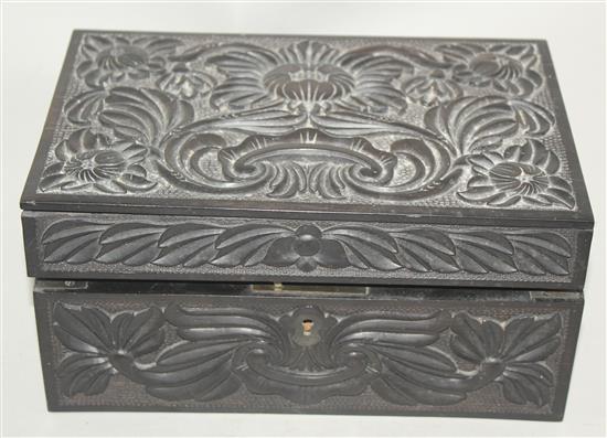 A 19th century Ceylonese carved ebony work box, 9.25in.